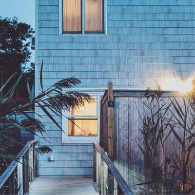 A close up of a beachhouse during dusk.